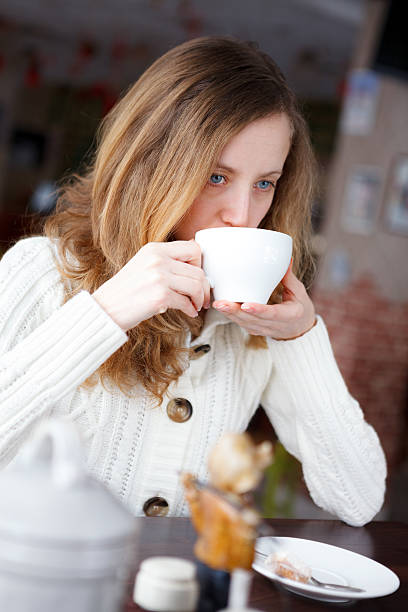 istock Young beautiful elegant woman drinking coffee or tea 178535223