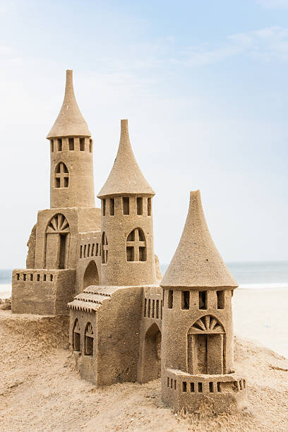 istock A sandcastle on the beach with windows and three turrets 178535351