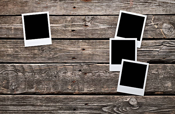 istock Blank photo frames on wood. 178535866