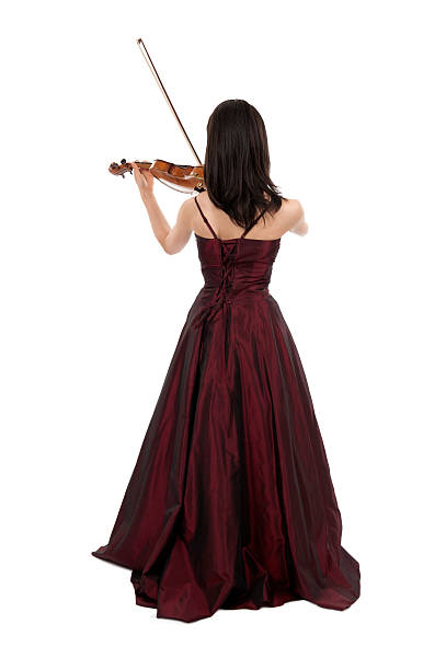 Young female violinist playing her violin on white background.