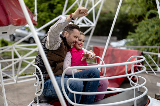 istock Father and Daughter Share Precious Time on the Merry-Go-Round 1785373097