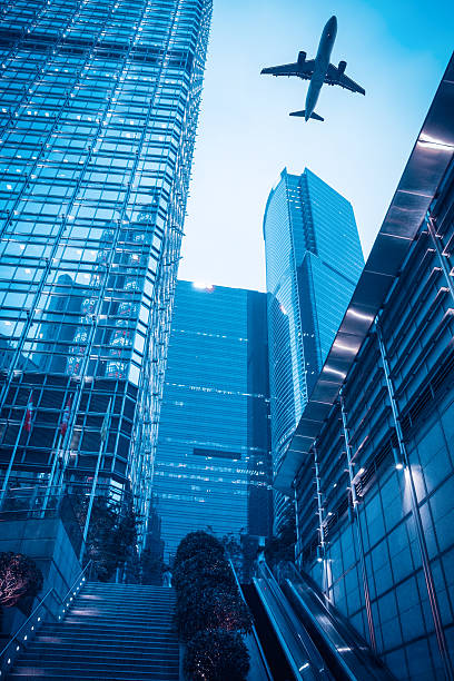 istock modern building with airplane at dusk 178537616