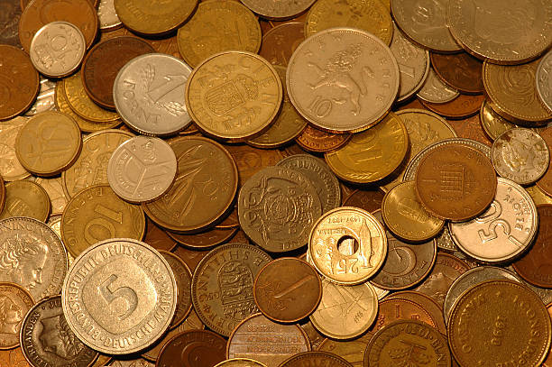 Huge pile of money, version deux. Most of these coins have been replaced by the Euro. dutch guilders stock pictures, royalty-free photos & images