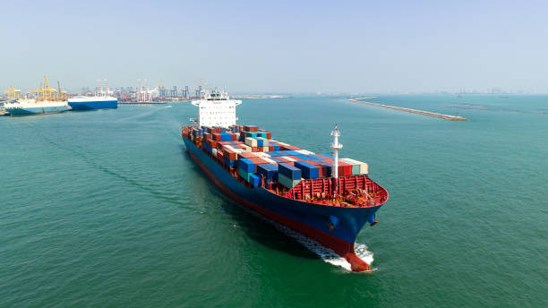 istock cargo container shipping sailing in sea import export logistic goods and distributing products to dealer and consumers across worldwide, by container ship Transport, business service. 1785379200