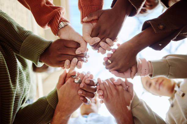 istock Below, students and holding hands for support, motivation or education in campus community. Diversity, friends and motivation for learning with teamwork, studying or scholarship at college together 1785379765