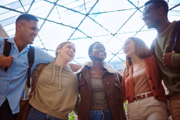 istock Student friends, diversity and happy together for motivation, support and education at university. Students, group and laugh with learning, teamwork or studying for scholarship at college for future 1785379773