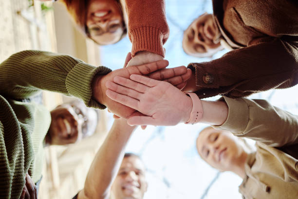 istock Below, hands stack and group of students for motivation, support or education in summer sunshine. Diversity, hand together and learning with teamwork, studying or scholarship at university for future 1785379774