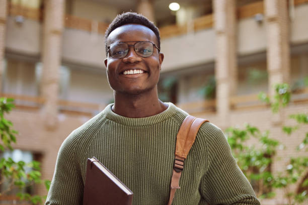 istock University student, black man and portrait at campus for education, learning and studying in Atlanta. Happy young male college student with motivation for knowledge, scholarship opportunity and goals 1785379783