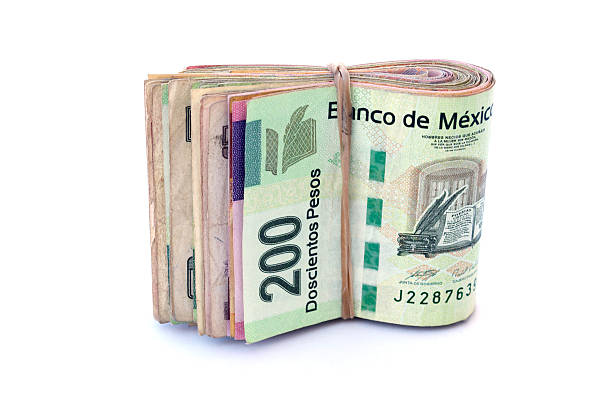 Mexican Currency A Stack of Mexican Currency bills mexican currency stock pictures, royalty-free photos & images