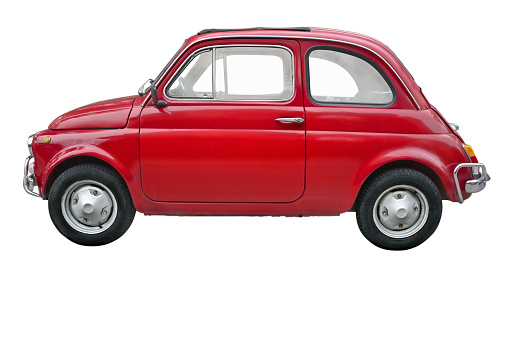 A small red old fashioned Fiat car on a white background