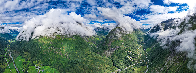 Aerial view from above the clouds  the valley of Videseter decending towards fjord in Norway