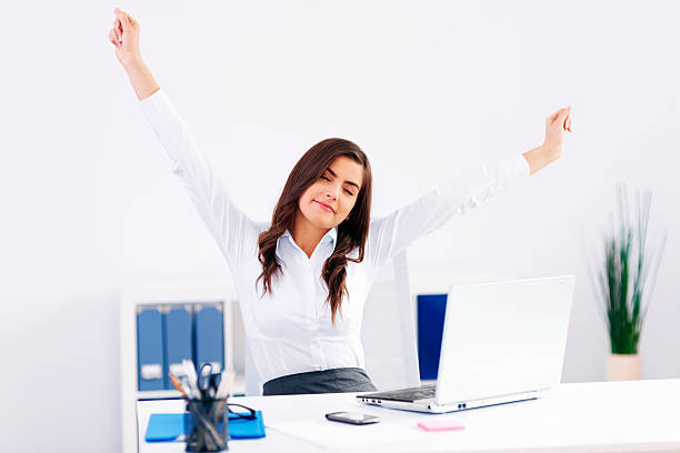 istock Young woman streaching at office 178539915