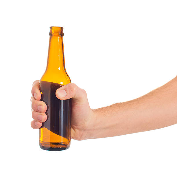 istock Close-up Of Hand Holding Empty Beer Bottle 178540224