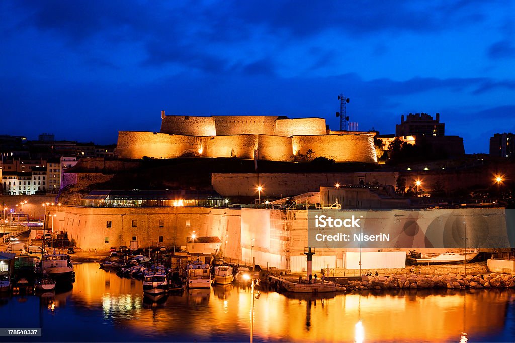 Marseille, France panorama at night, the harbour and cathedral. Marseille, France at night. Part of Fort Saint-Jean at the harbour entrance. Cathedral Stock Photo