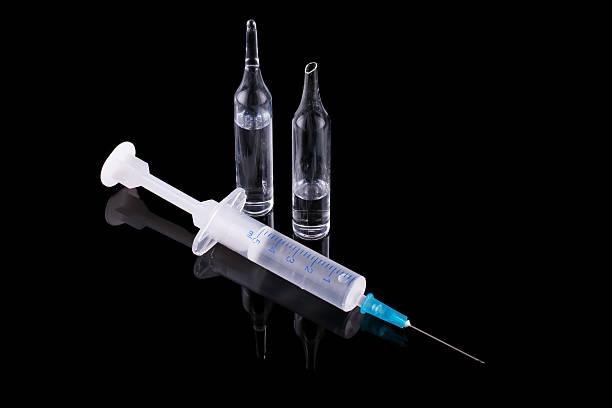 istock syringe and glass vial 178540373