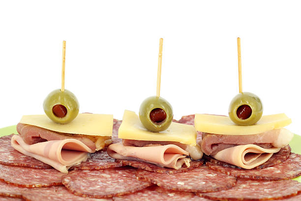 istock olive cheese ham and salami on white 178540479