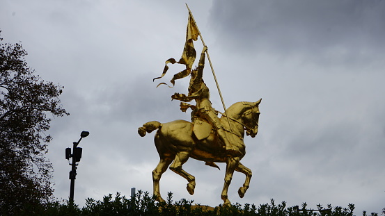 Golden Statue of man riding a horse in Philadelpia, Pennsylvania.