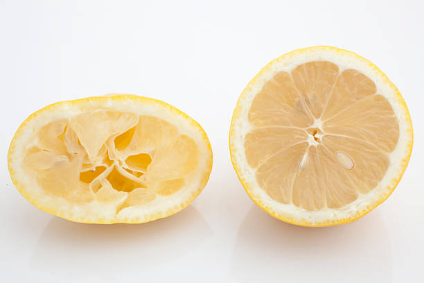 squeezed half lemon stock photo