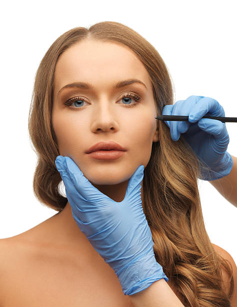 istock woman face and beautician hands 178541102