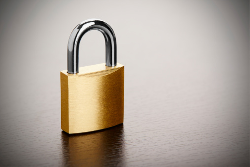 Bronze padlock on table closeup