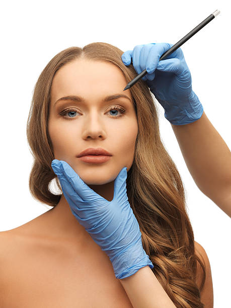 istock woman face and beautician hands 178541345