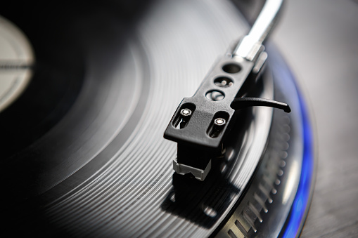 Professional audio equipment for disc jockey. Retro vinyl record player in closeup