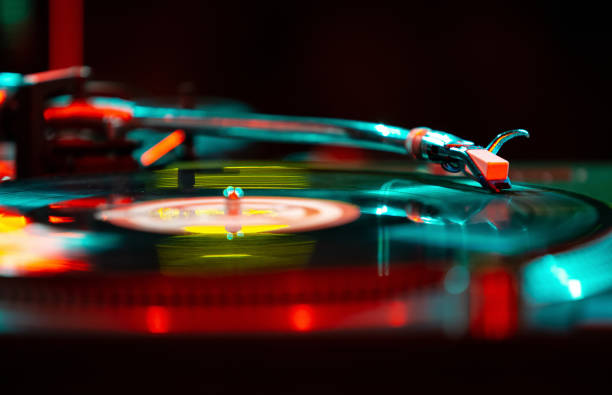 istock Dj turntable on stage. Turntables needle playing music in nightclub 1785427761