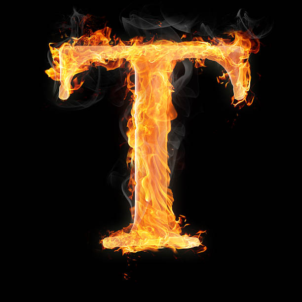 Burning objects and things on fire Letters and symbols in fire - Letter T. fire alphabet letter t stock pictures, royalty-free photos & images