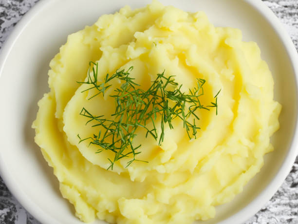 istock Thanksgiving Mashed Potatoes with Green Garnish 1785448350