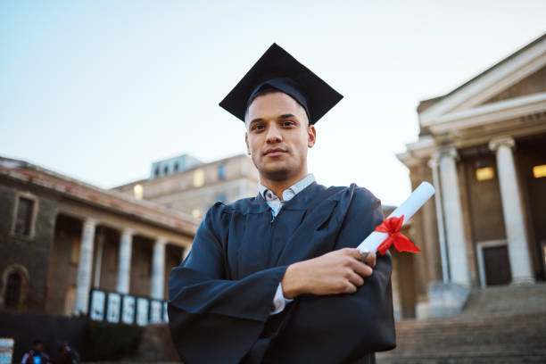 istock Student graduation, portrait and man with certificate, diploma or degree. University education, college and proud male graduate from Brazil with arms crossed and academic document for learning goals. 1785449320
