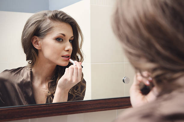 istock Young beautiful girl does makeup 178545411