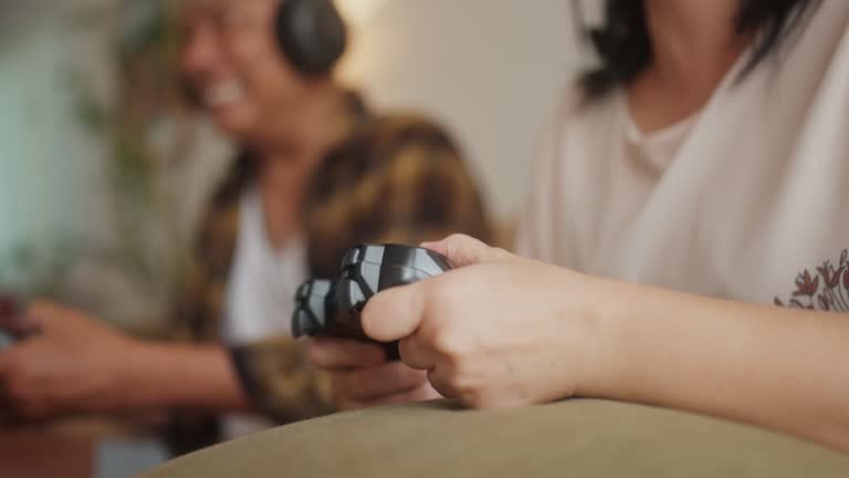 Senior Couple Embraces Joyful Gaming in Living Space.