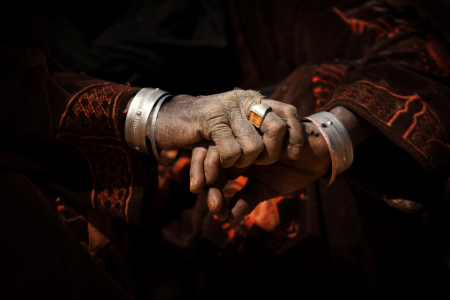 Hands of a woman nomad in the desert