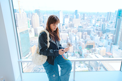 istock Asian traveler stand looking at the view from the Umeda sky building view point, Osaka, Japan. 1785463110