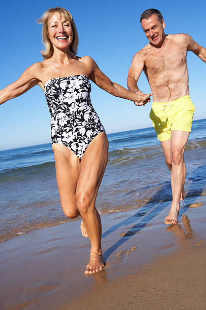 istock Senior Couple Enjoying Beach Holiday 178546325