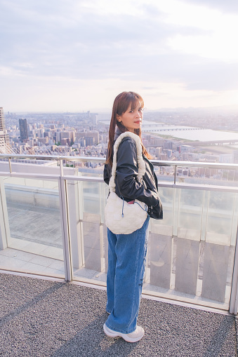 istock Asian traveler stand looking at the view from the Umeda sky building view point, Osaka, Japan. 1785463374
