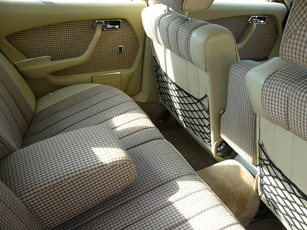 istock Rear beige checkered seats and doors of retro car 178546558
