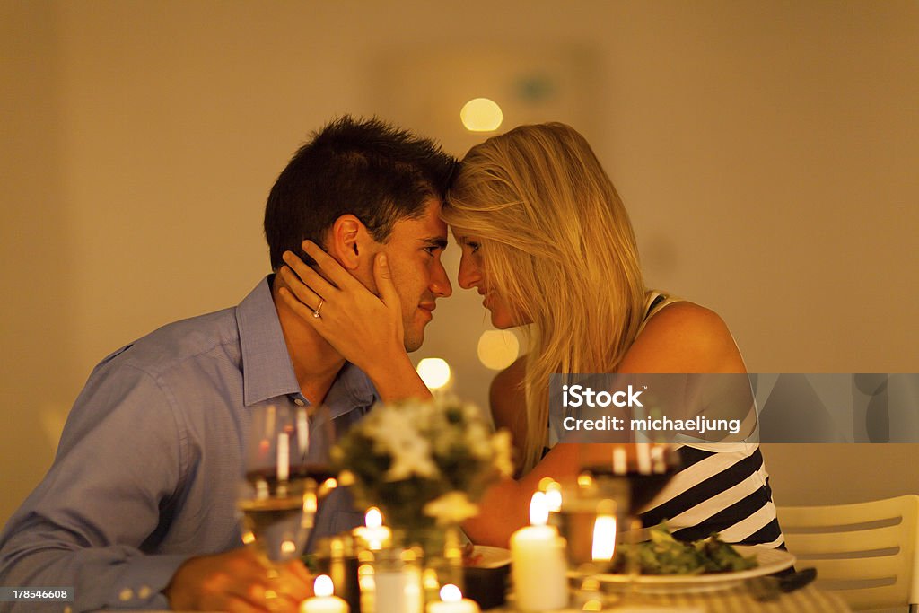 young loving couple having romantic dinner young loving couple having romantic dinner together Adult Stock Photo