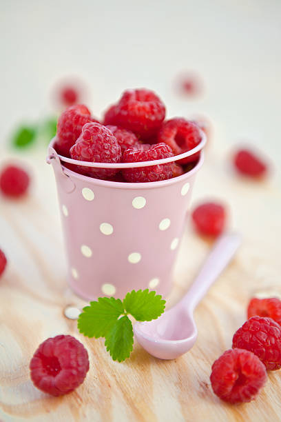 istock Fresh raspberries in a little vintage bucket 178546649