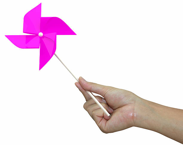 istock hand with pink pinwheel on white background 178547079