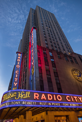 New York, NY, United States - July 23, 2023: Radio City Music Hall building on 6th avenue at night at Rockefeller Center, Manhattan