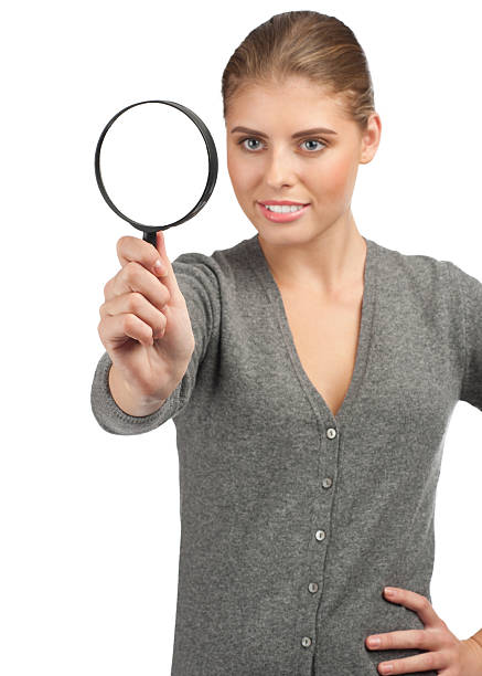 istock Woman looking through a magnifying glass 178547853