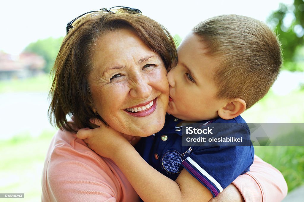 happy grandma with grandson embracing outdoor Grandmother Stock Photo