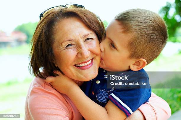 Happy Grandma With Grandson Embracing Outdoor Stock Photo - Download Image Now - Grandmother, Grandson, Child