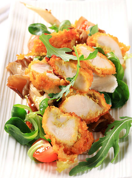 istock Breaded chicken breast with salad greens 178548270