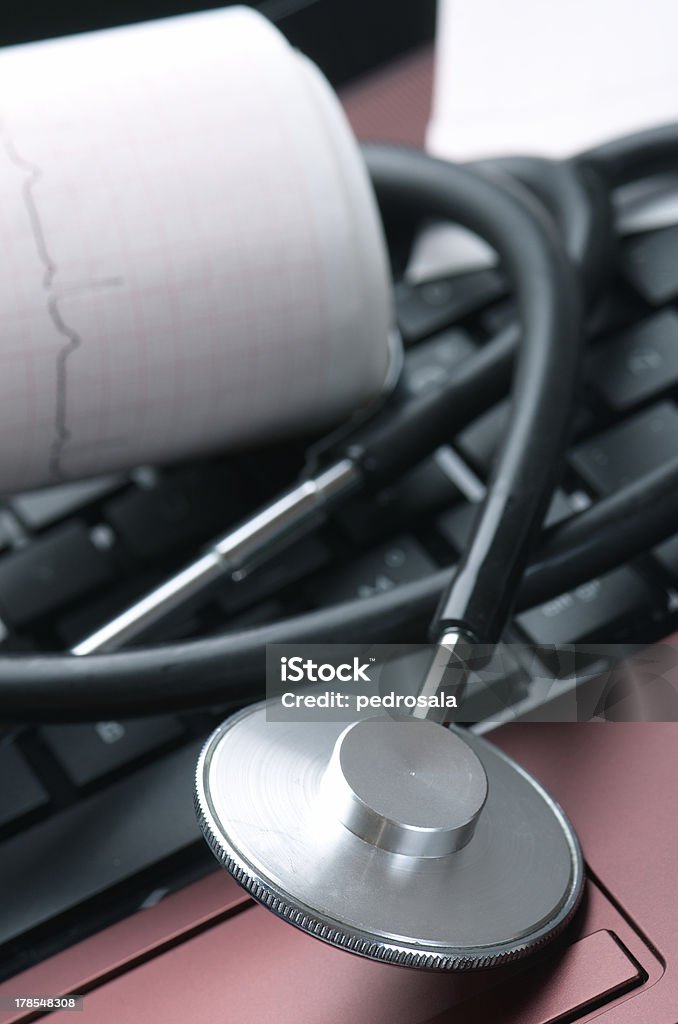 online close up of a stethoscope and a computer keyboard Black Color Stock Photo