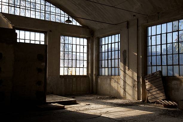 shadows in the abandoned factory stock photo