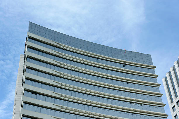 istock Maintenance workers on glass curtain wall 178548713