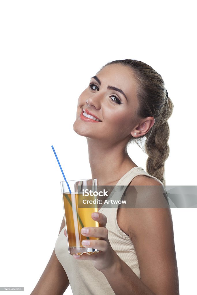 Portrait of happy young woman with juice on white backg Close-up portrait of happy young woman with juice on white background.  Concept vegetarian dieting - healthy food Adult Stock Photo