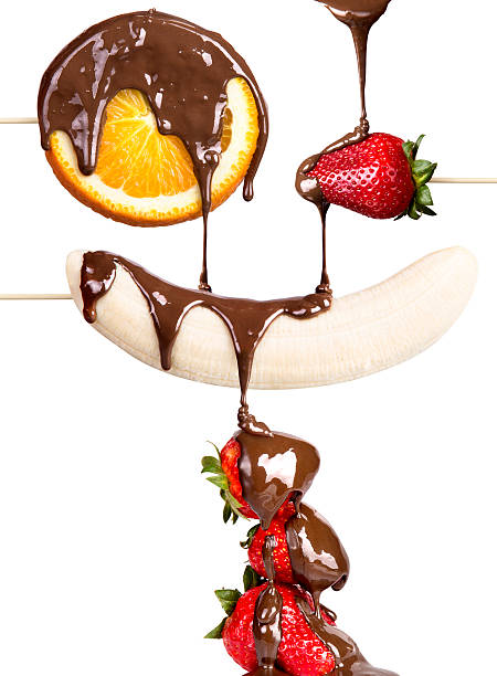 istock strawberries, orange and banana with chocolate 178550200